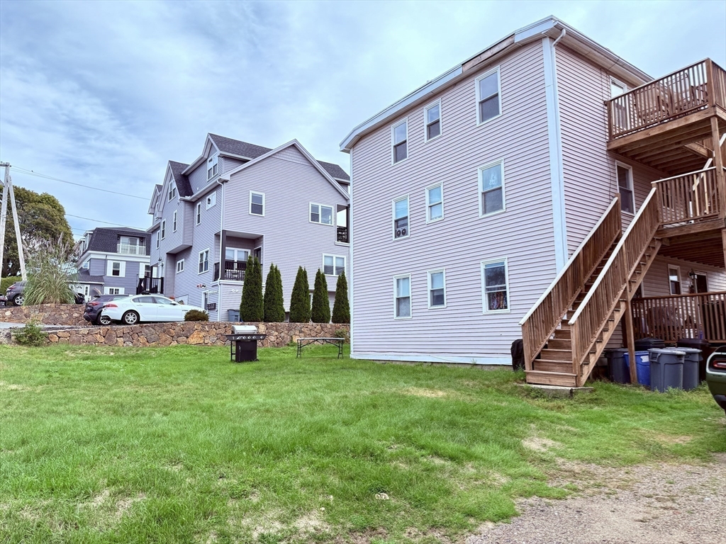 16 Cox Court, Unit 3 Beverly, MA 01915 - Photo 13 of 14 a view of a house with a yard and sitting area