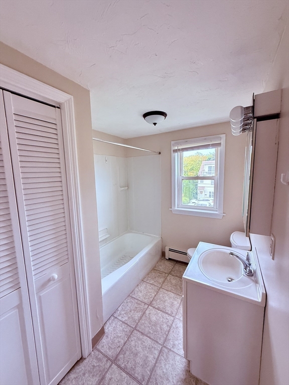16 Cox Court, Unit 3 Beverly, MA 01915 - Photo 10 of 14 a bathroom with a sink a bathtub and a shower
