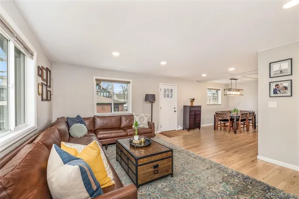 a living room with furniture and a table