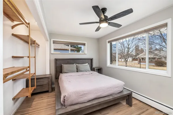 a bedroom with a large bed and a window