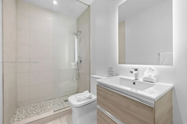 a bedroom with a large bed and a large window