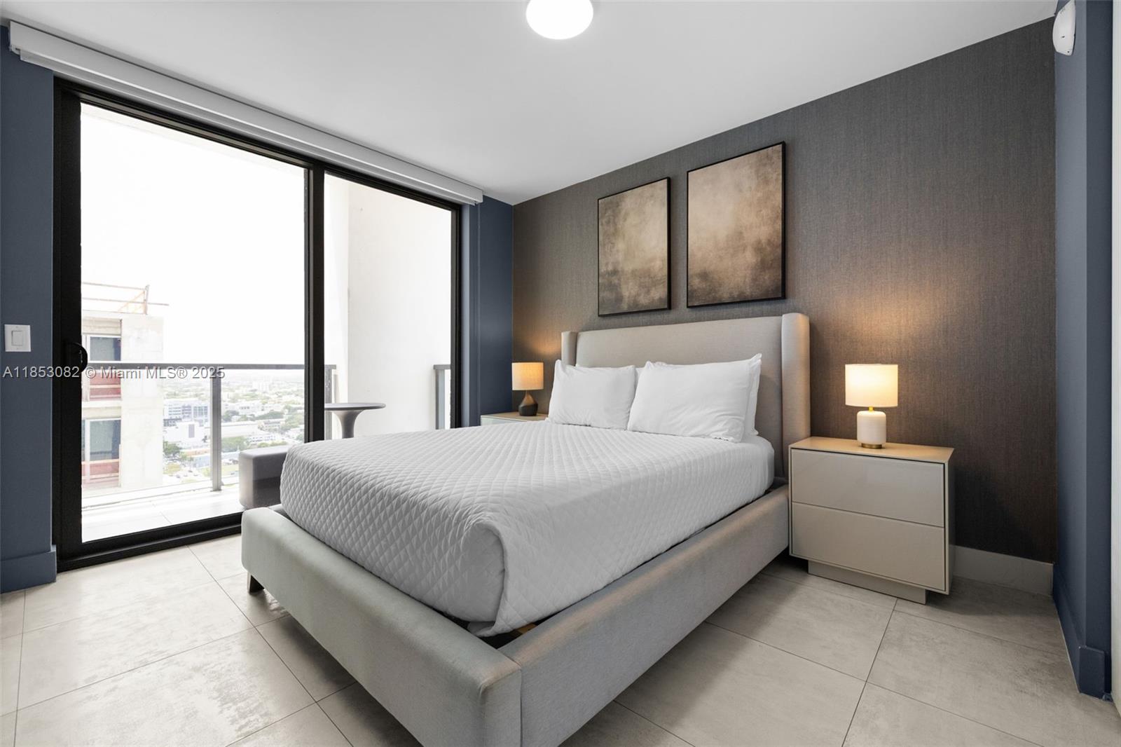 239 Southwest 9th Street, Unit 2303 Miami, FL 33130 - Photo 18 of 75 a bedroom with a large bed and a large window