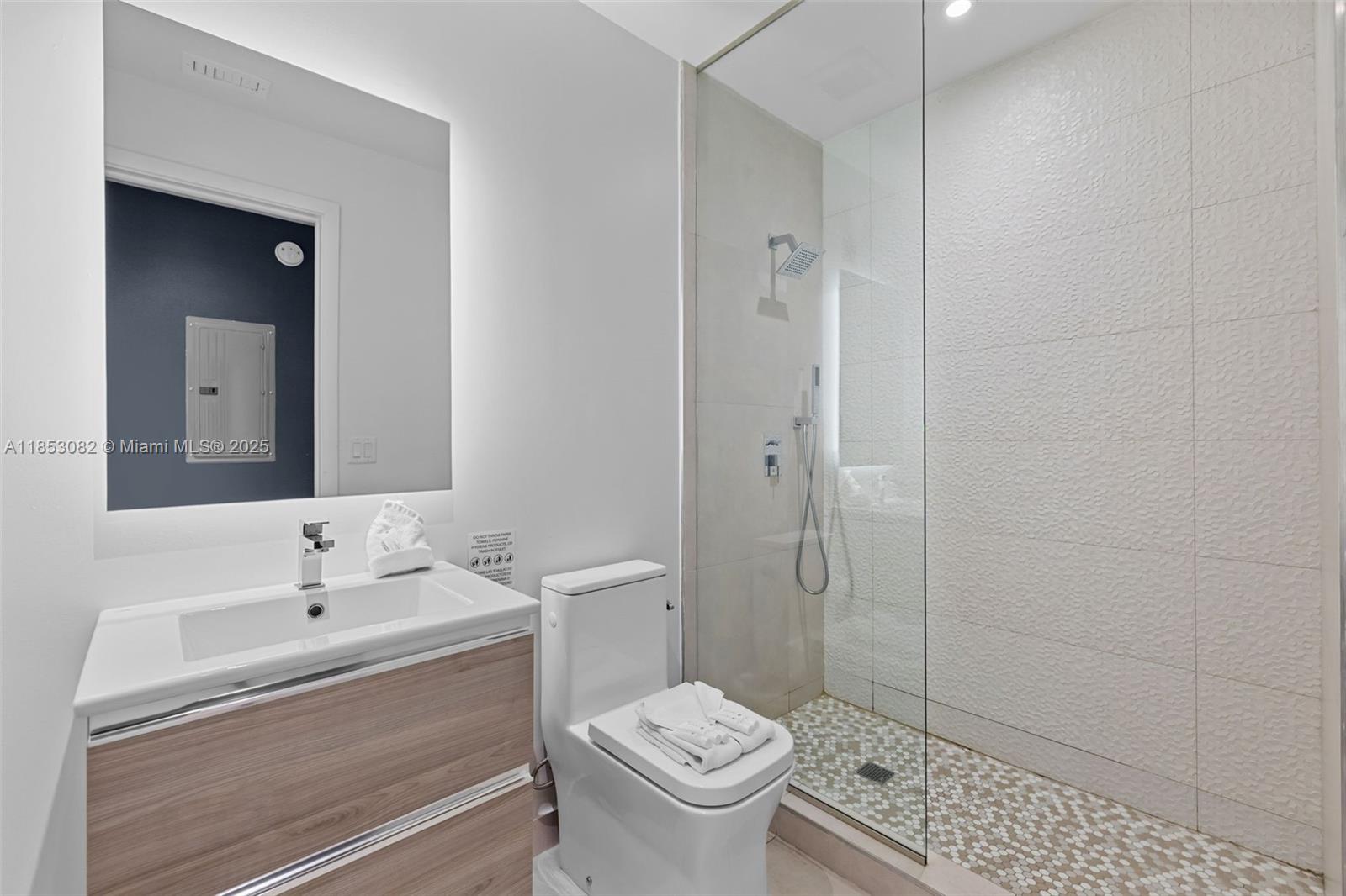 239 Southwest 9th Street, Unit 2303 Miami, FL 33130 - Photo 20 of 75 a bathroom with a sink a toilet and shower