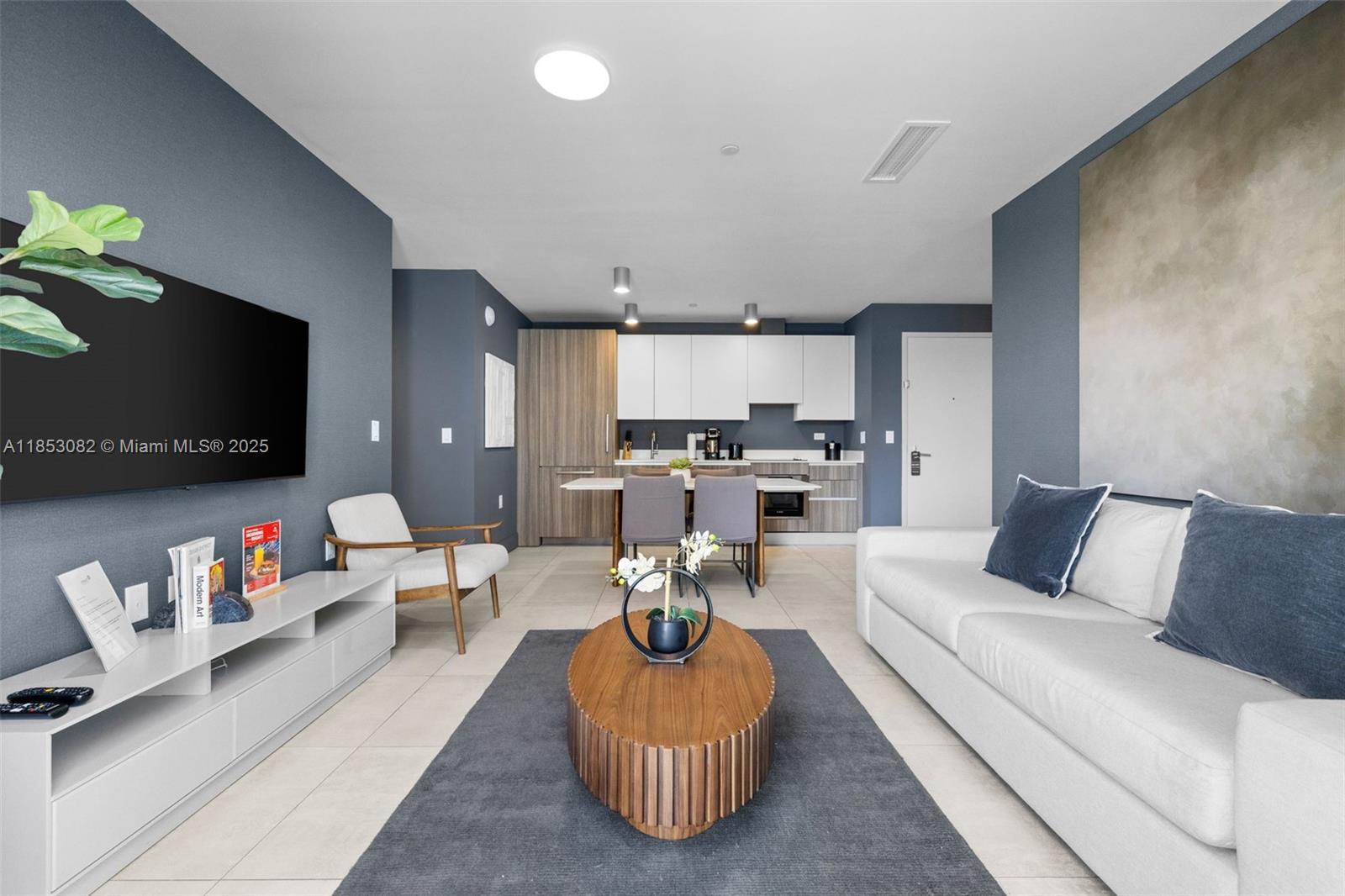 239 Southwest 9th Street, Unit 2303 Miami, FL 33130 - Photo 28 of 75 a living room with furniture and a flat screen tv