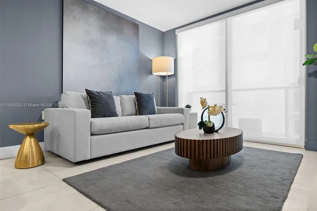 a kitchen with stainless steel appliances kitchen island granite countertop a refrigerator a stove a sink dishwasher with a dining table and chairs