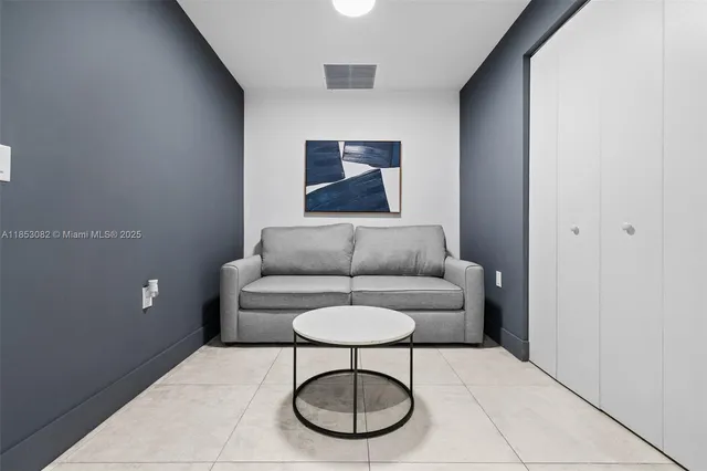 a bedroom with a bed and a mirror