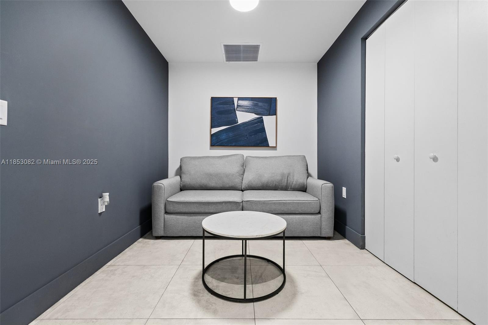 239 Southwest 9th Street, Unit 2303 Miami, FL 33130 - Photo 43 of 75 a living room with furniture a rug and a table