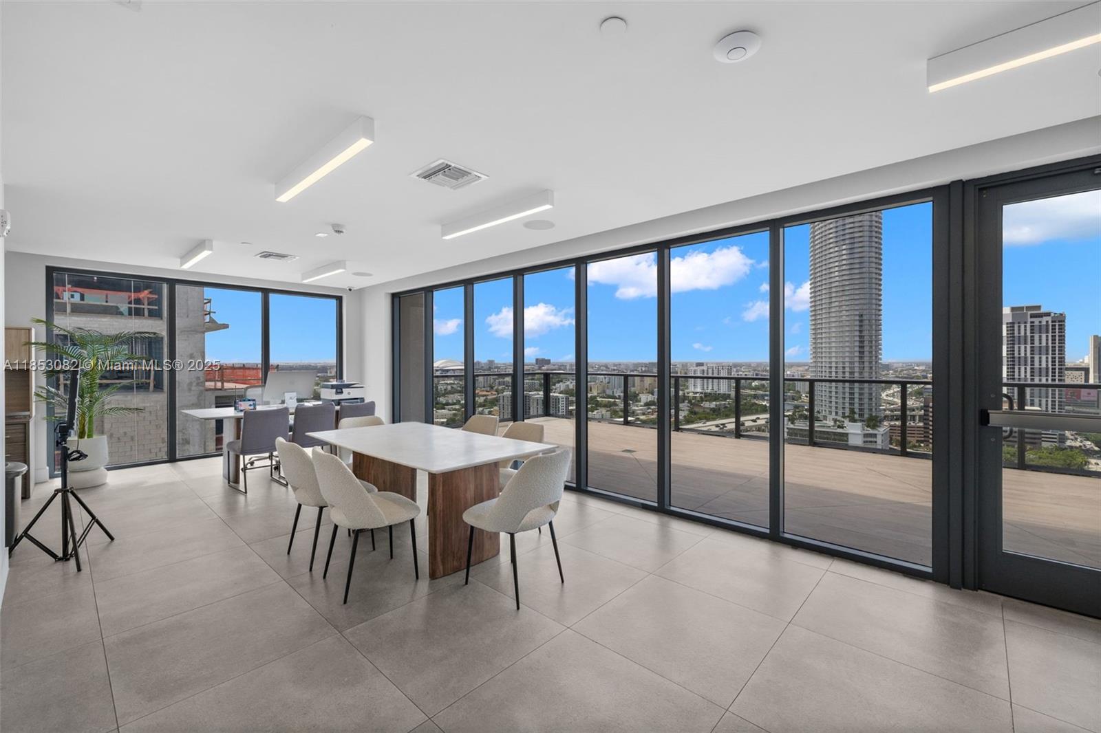 239 Southwest 9th Street, Unit 2303 Miami, FL 33130 - Photo 54 of 75 a view of a dining room with furniture window and outside view