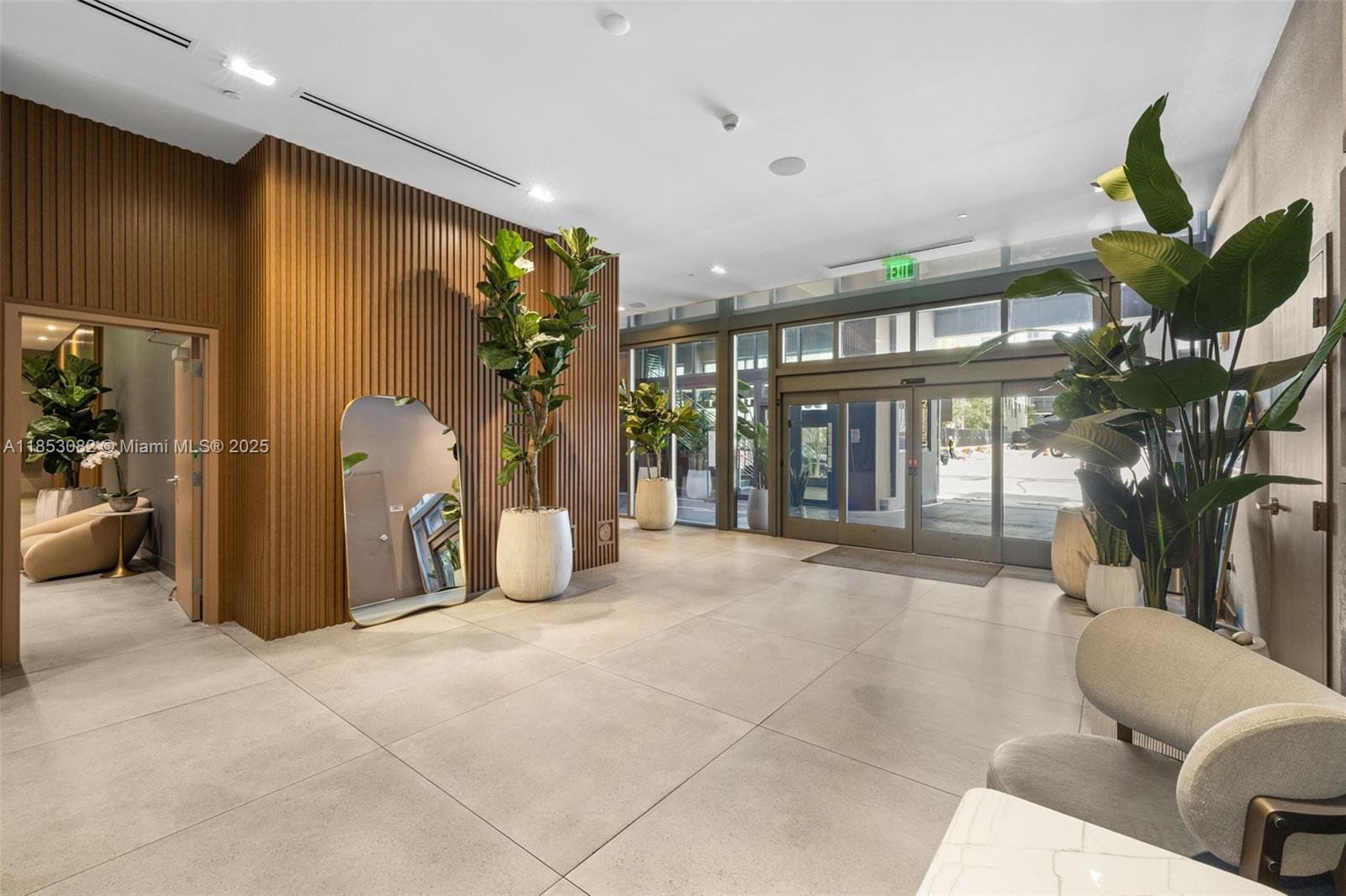 239 Southwest 9th Street, Unit 2303 Miami, FL 33130 - Photo 72 of 75 a living room with furniture a chandelier and a large window