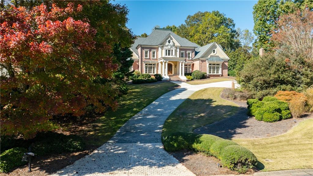 9390 Colonnade Trail Alpharetta, GA 30022 - Photo 103 of 122 a front view of a house with a yard