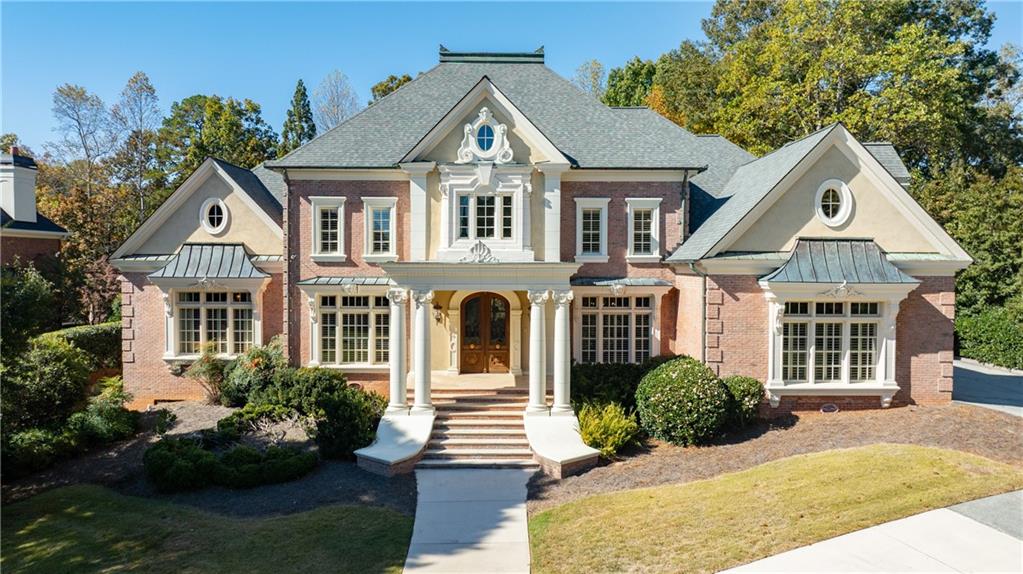 9390 Colonnade Trail Alpharetta, GA 30022 - Photo 113 of 122 a front view of a house with garden