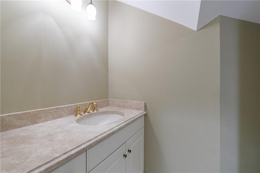 9390 Colonnade Trail Alpharetta, GA 30022 - Photo 61 of 122 a bathroom with a sink and vanity