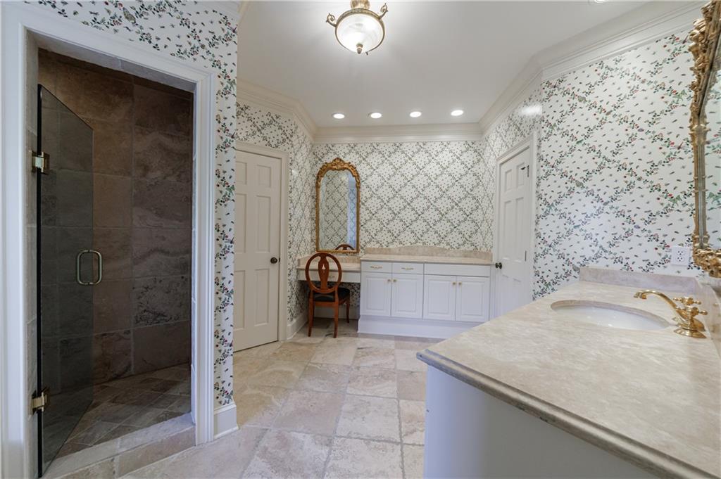 9390 Colonnade Trail Alpharetta, GA 30022 - Photo 69 of 122 a bathroom with a sink a toilet and shower
