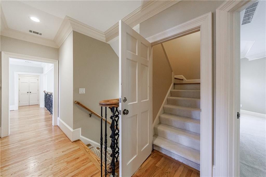 9390 Colonnade Trail Alpharetta, GA 30022 - Photo 70 of 122 a view of a hallway with wooden floor and entryway