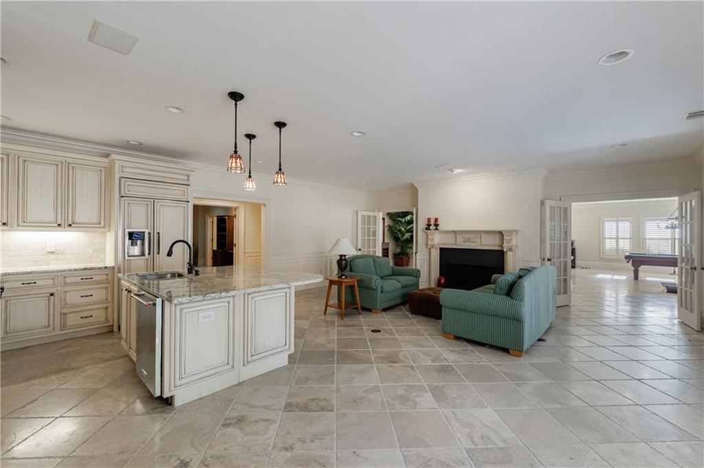 9390 Colonnade Trail Alpharetta, GA 30022 - Photo 77 of 122 a kitchen with furniture and a fireplace