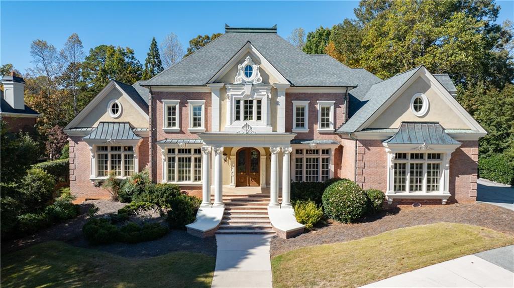 9390 Colonnade Trail Alpharetta, GA 30022 - Photo 98 of 122 a front view of a house with a yard