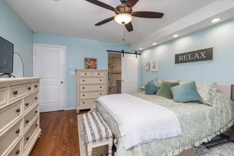a bed room with a bed and a dresser