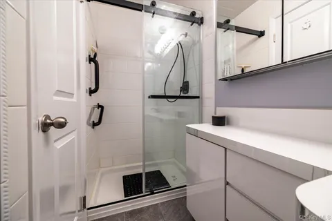 a bathroom with a sink and mirror