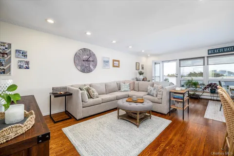 a living room with furniture or couch and a wooden floor
