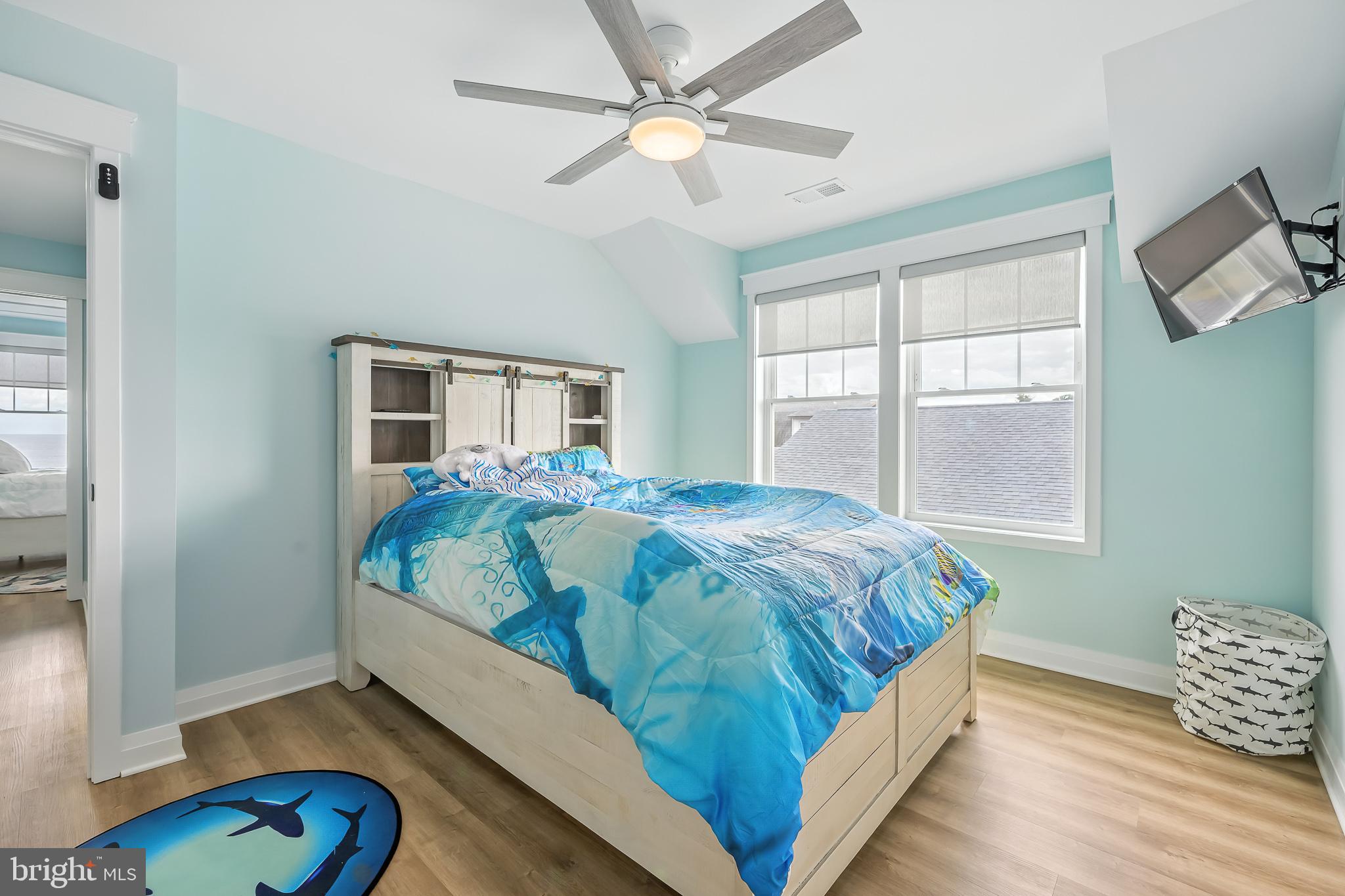 549 Bay Avenue Milford, DE 19963 - Photo 22 of 60 a bed sitting in a bedroom next to a window