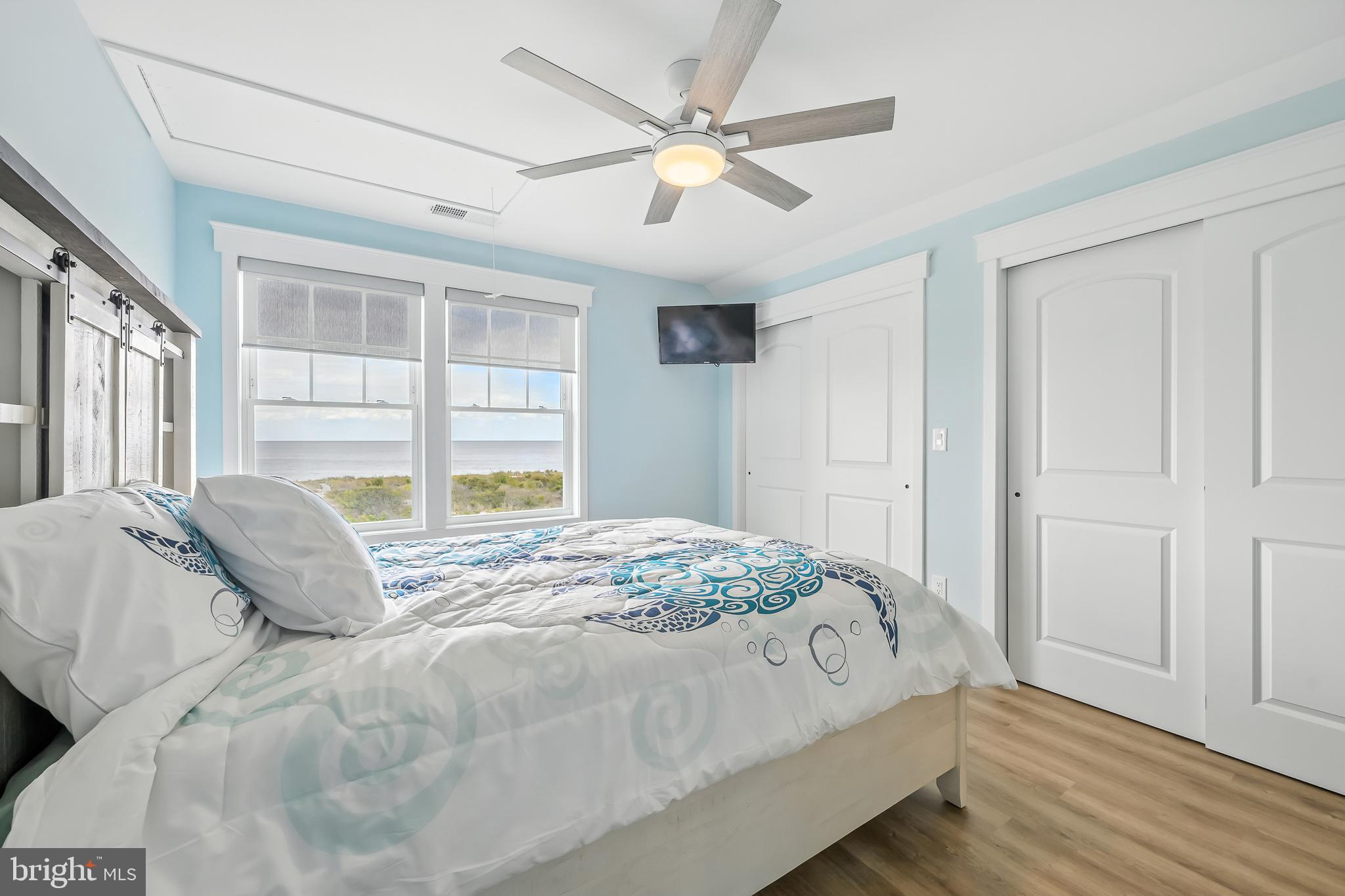 549 Bay Avenue Milford, DE 19963 - Photo 25 of 60 a bedroom with a large bed and a large window