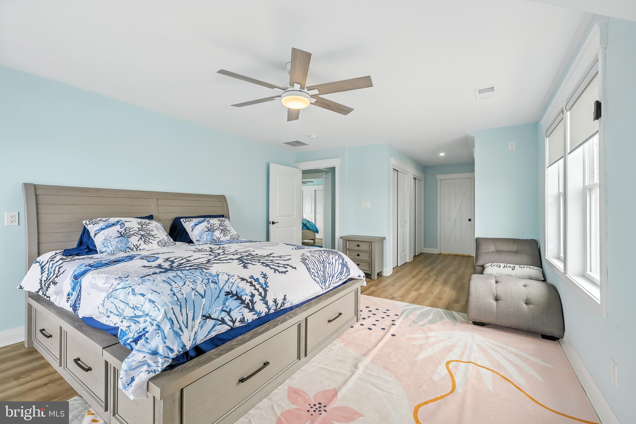 549 Bay Avenue Milford, DE 19963 - Photo 29 of 60 a bedroom with double bed and a chandelier