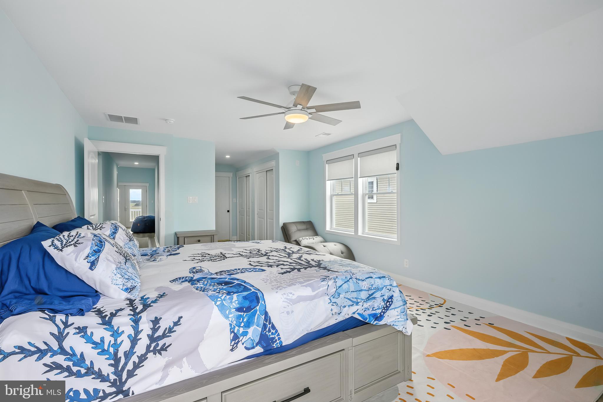 549 Bay Avenue Milford, DE 19963 - Photo 30 of 60 a bedroom with a bed and a chandelier