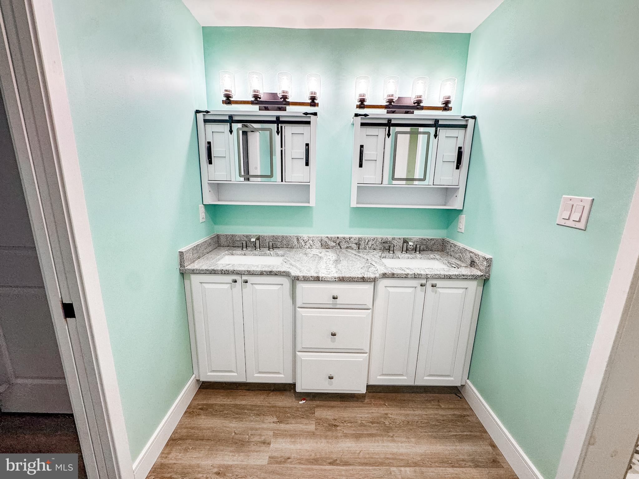 549 Bay Avenue Milford, DE 19963 - Photo 36 of 60 a kitchen with granite countertop a sink and cabinets