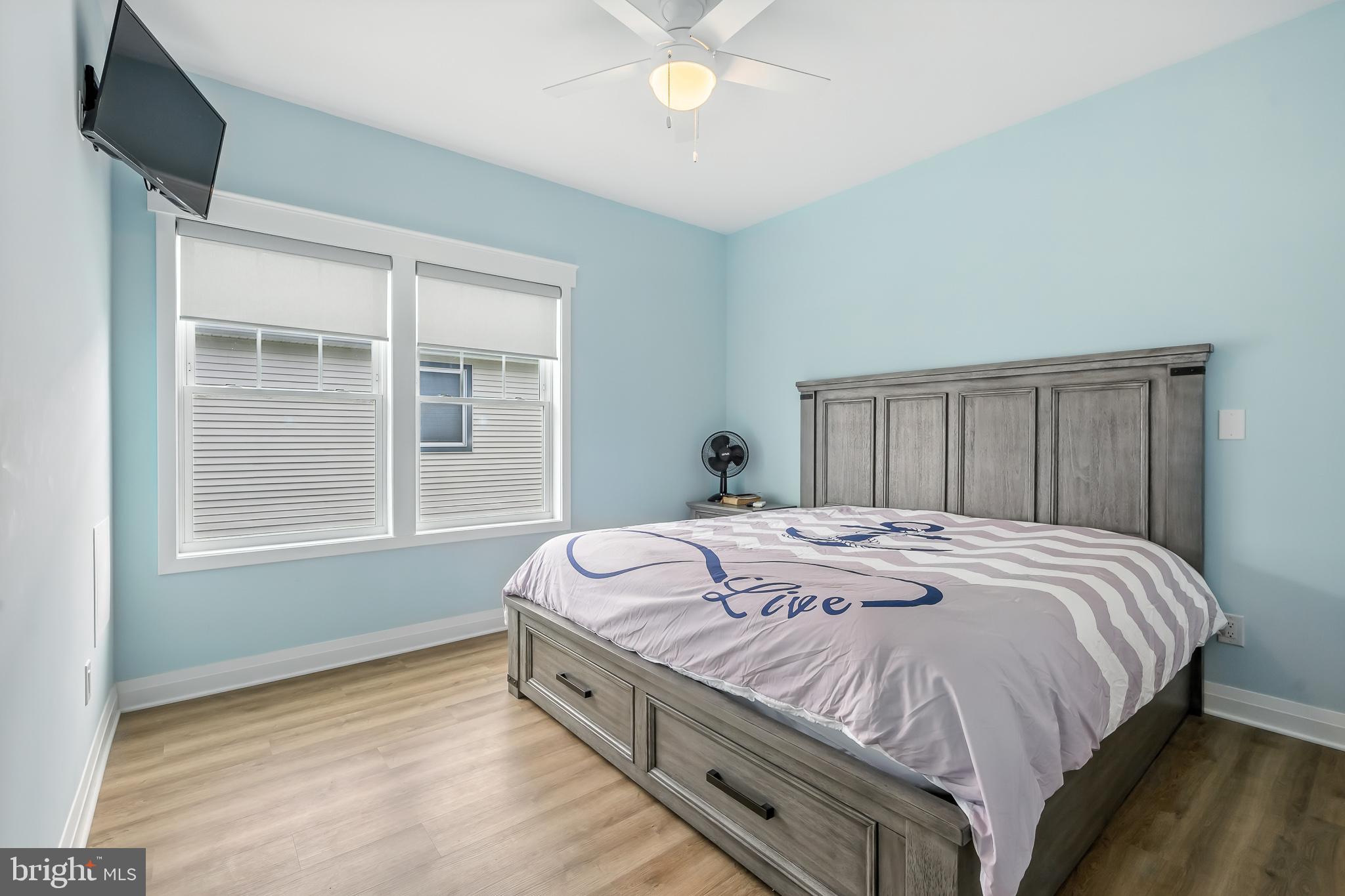 549 Bay Avenue Milford, DE 19963 - Photo 43 of 60 a spacious bedroom with a bed and a window
