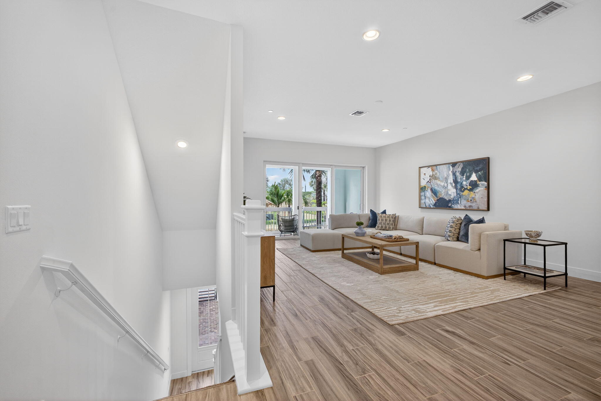13392 Alton Road Palm Beach Gardens, FL 33418 - Photo 11 of 57 a living room with furniture and a wooden floor
