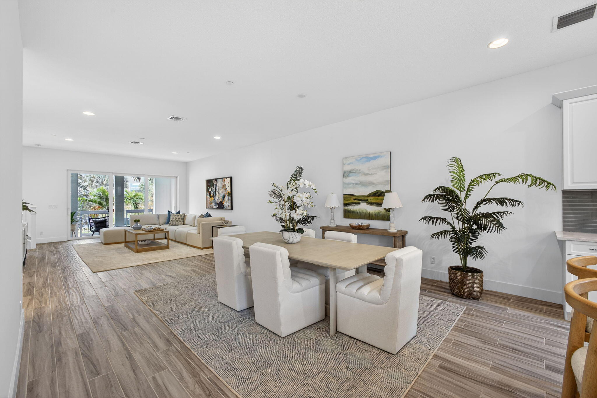 13392 Alton Road Palm Beach Gardens, FL 33418 - Photo 18 of 57 a view of a dining room with furniture and a potted plant