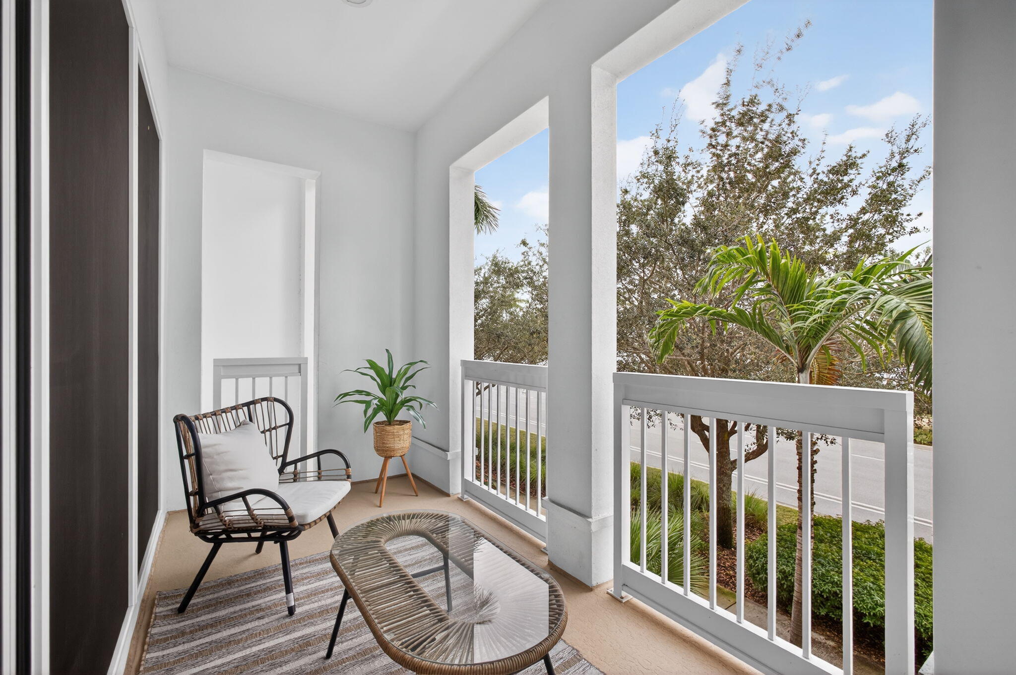13392 Alton Road Palm Beach Gardens, FL 33418 - Photo 28 of 57 a view of a balcony with furniture