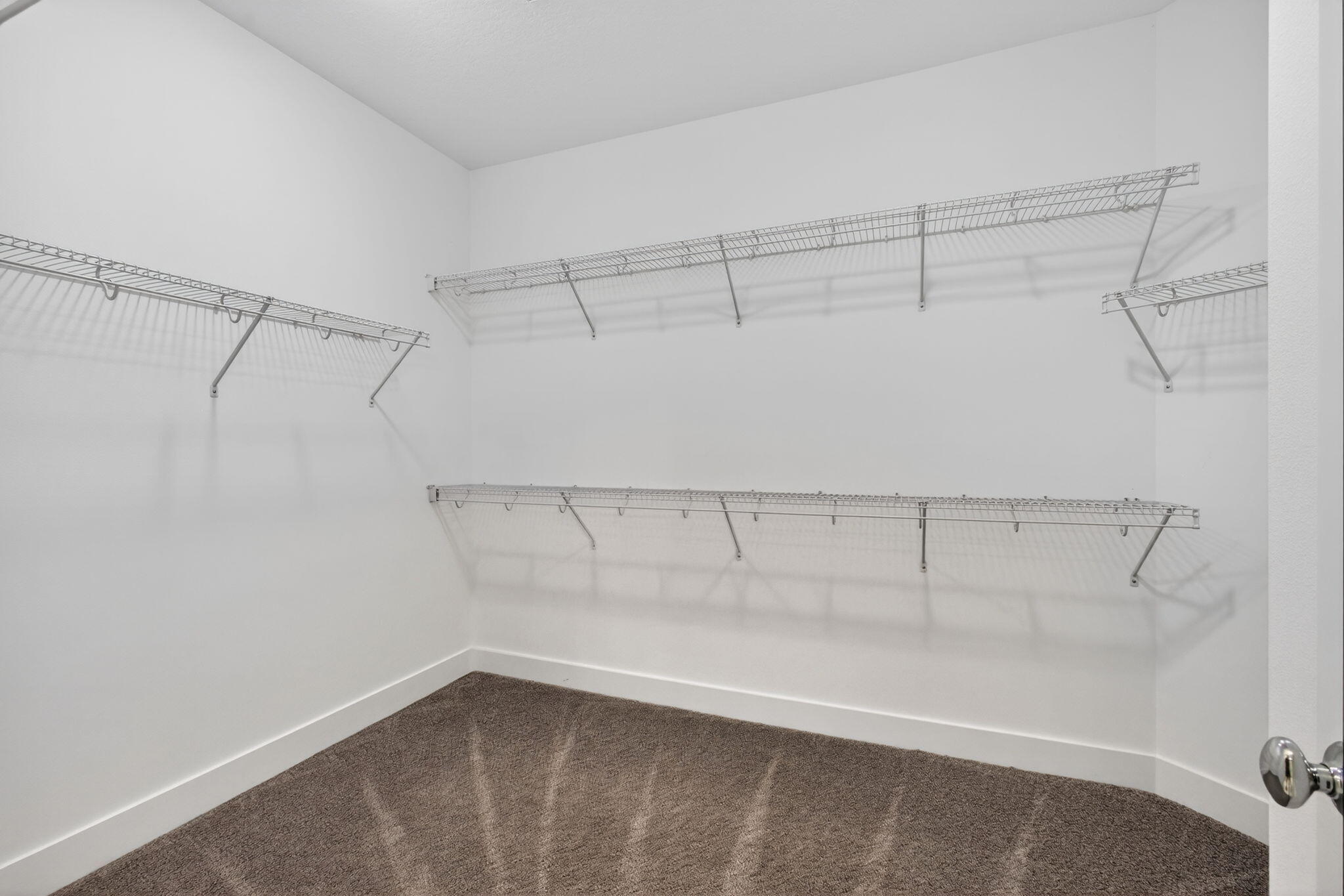 13392 Alton Road Palm Beach Gardens, FL 33418 - Photo 36 of 57 a view of a room with racks on the wall