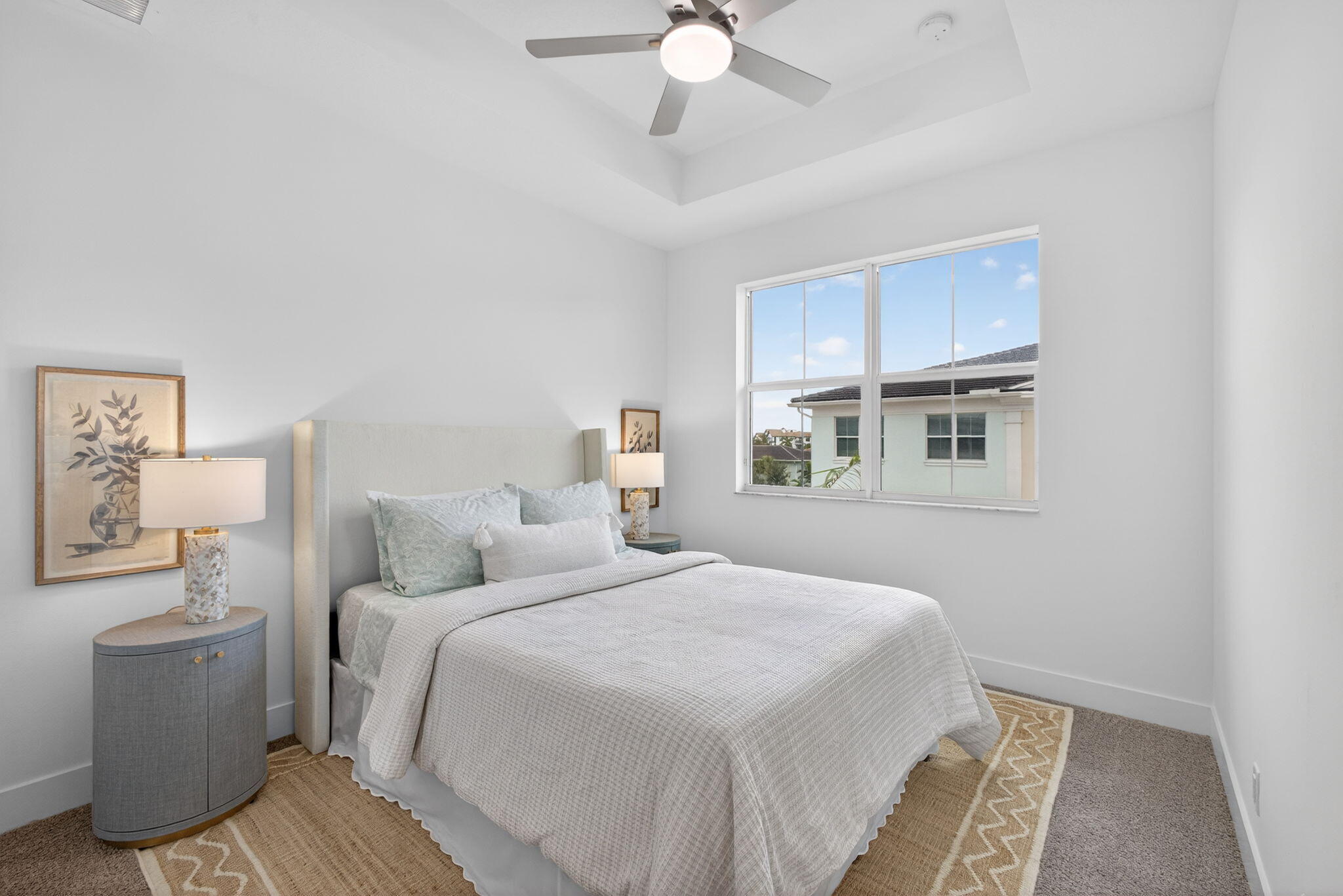 13392 Alton Road Palm Beach Gardens, FL 33418 - Photo 39 of 57 a bedroom with a bed and a chandelier