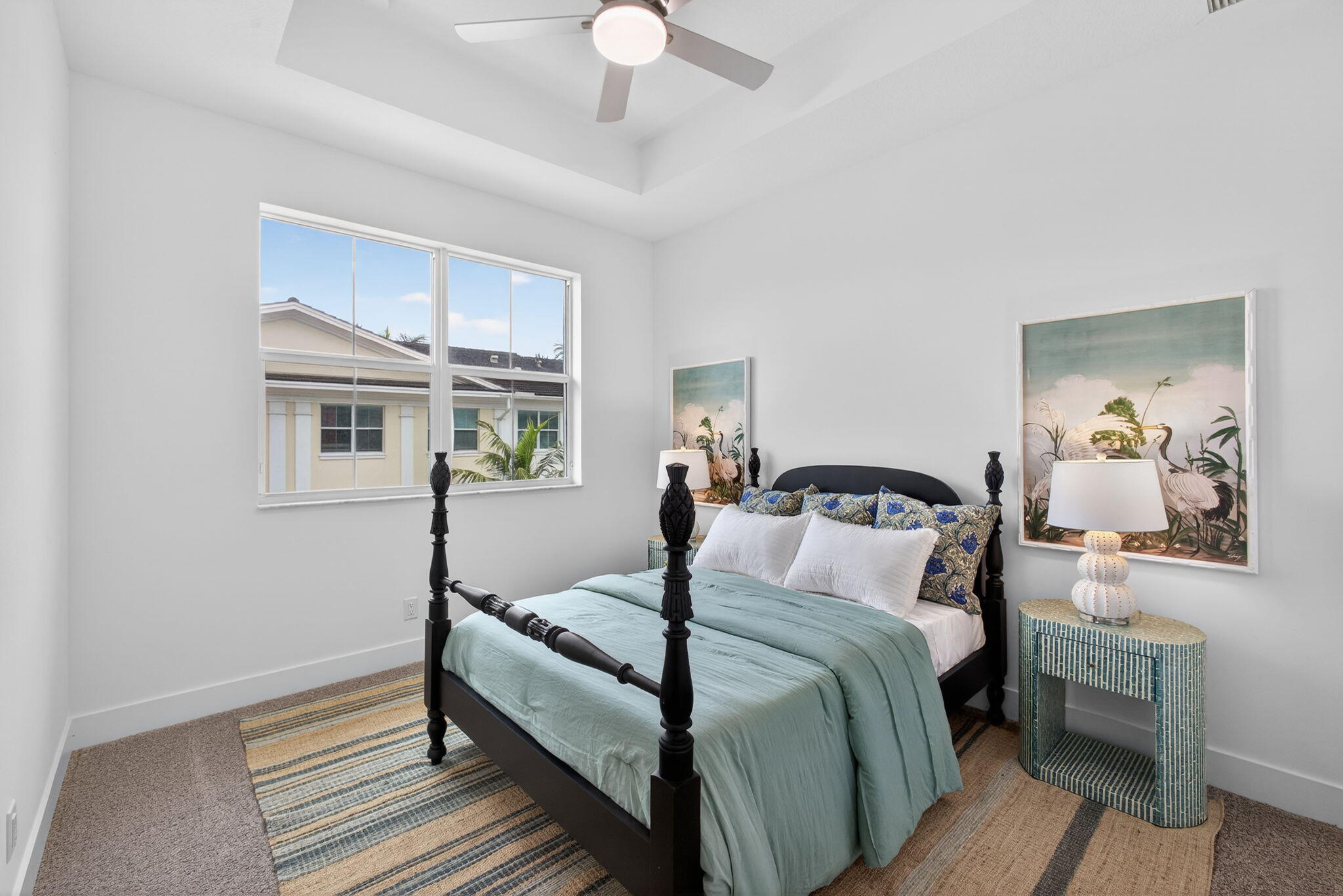 13392 Alton Road Palm Beach Gardens, FL 33418 - Photo 40 of 57 a bedroom with a bed and a painting on the wall