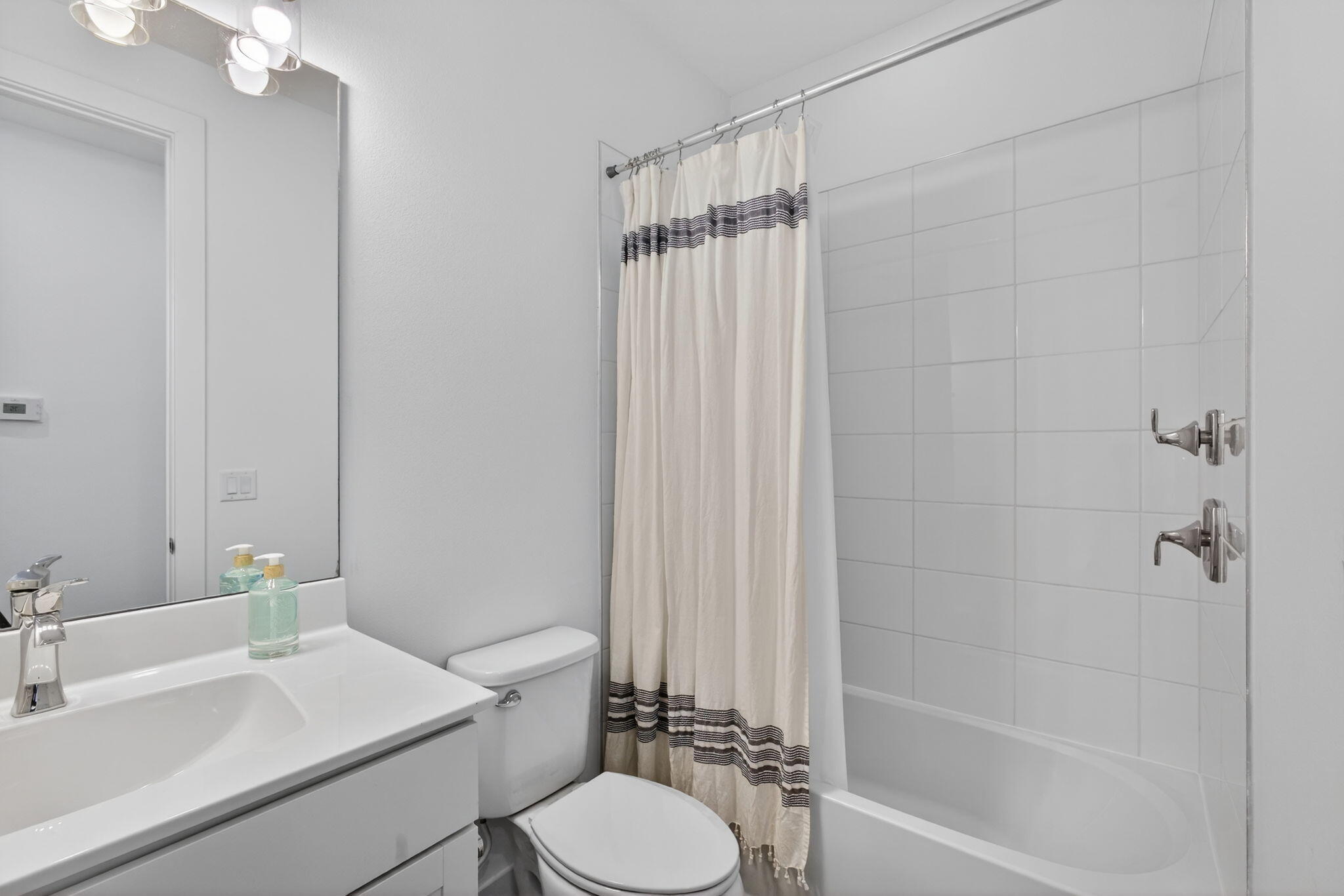 13392 Alton Road Palm Beach Gardens, FL 33418 - Photo 43 of 57 a bathroom with a sink toilet and shower