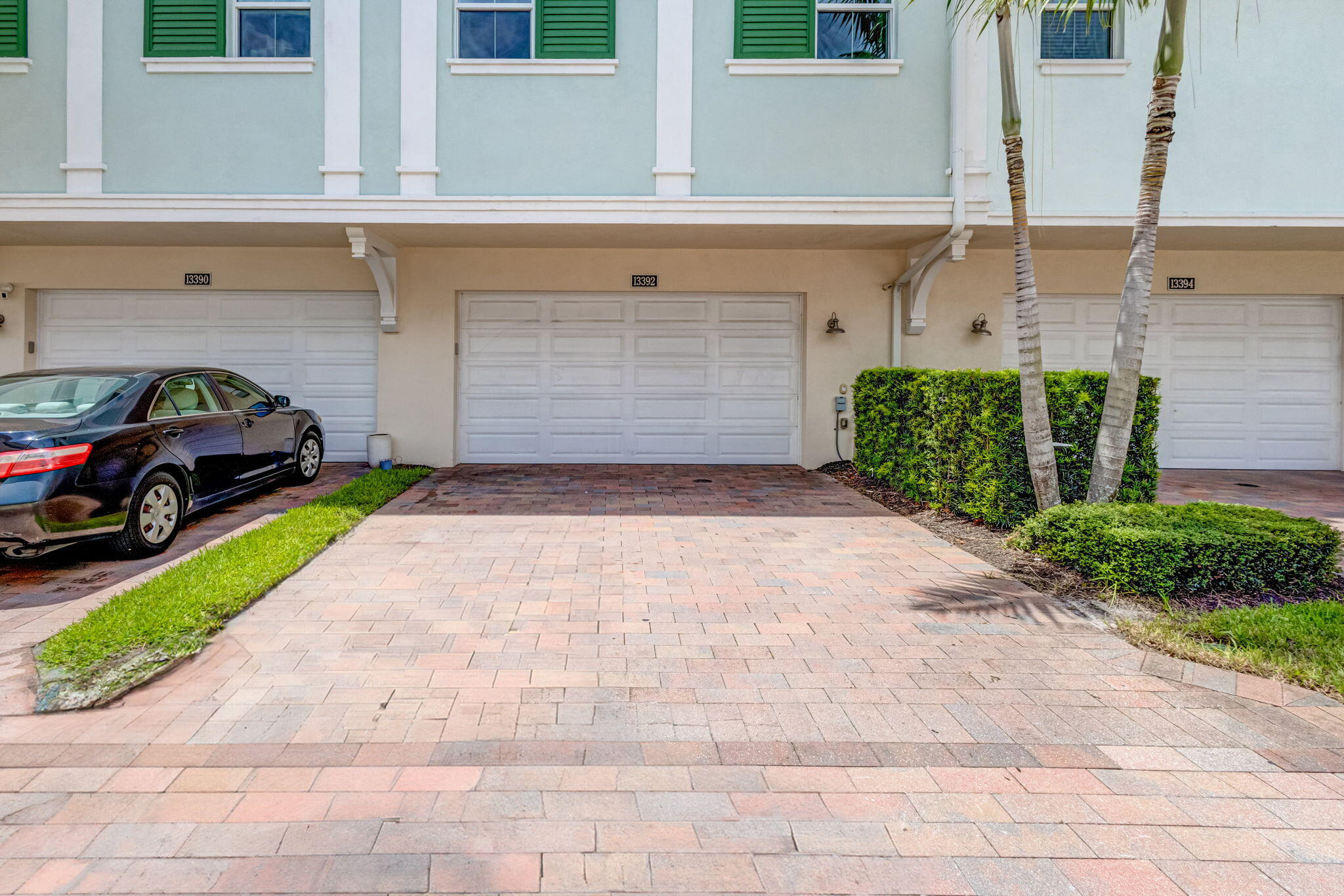 13392 Alton Road Palm Beach Gardens, FL 33418 - Photo 49 of 57 a front view of a house with a yard and garage