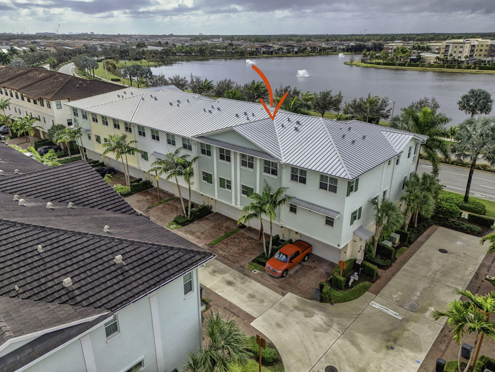 13392 Alton Road Palm Beach Gardens, FL 33418 - Photo 50 of 57 an aerial view of a house with a lake view