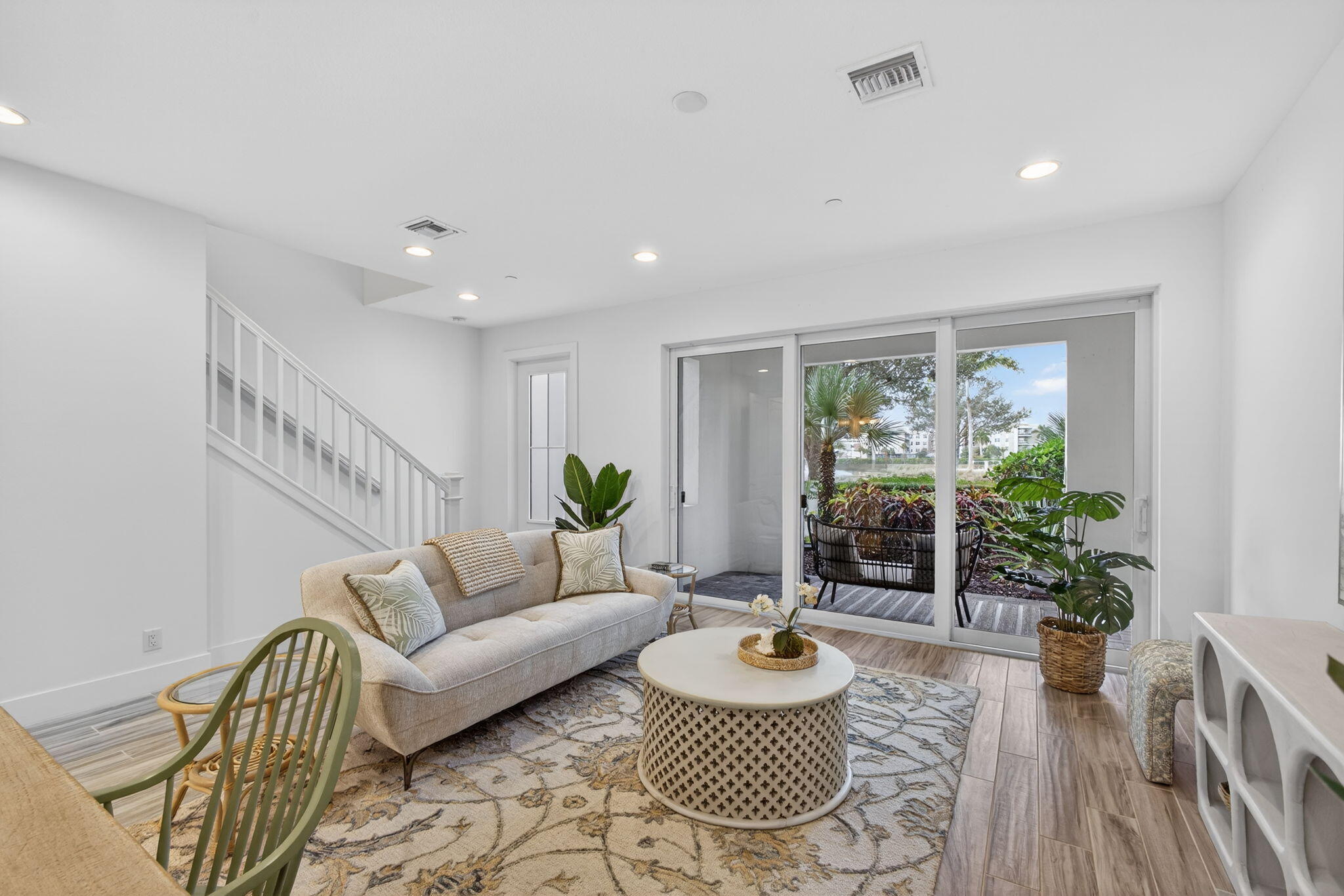 13392 Alton Road Palm Beach Gardens, FL 33418 - Photo 5 of 57 a living room with furniture and a potted plant