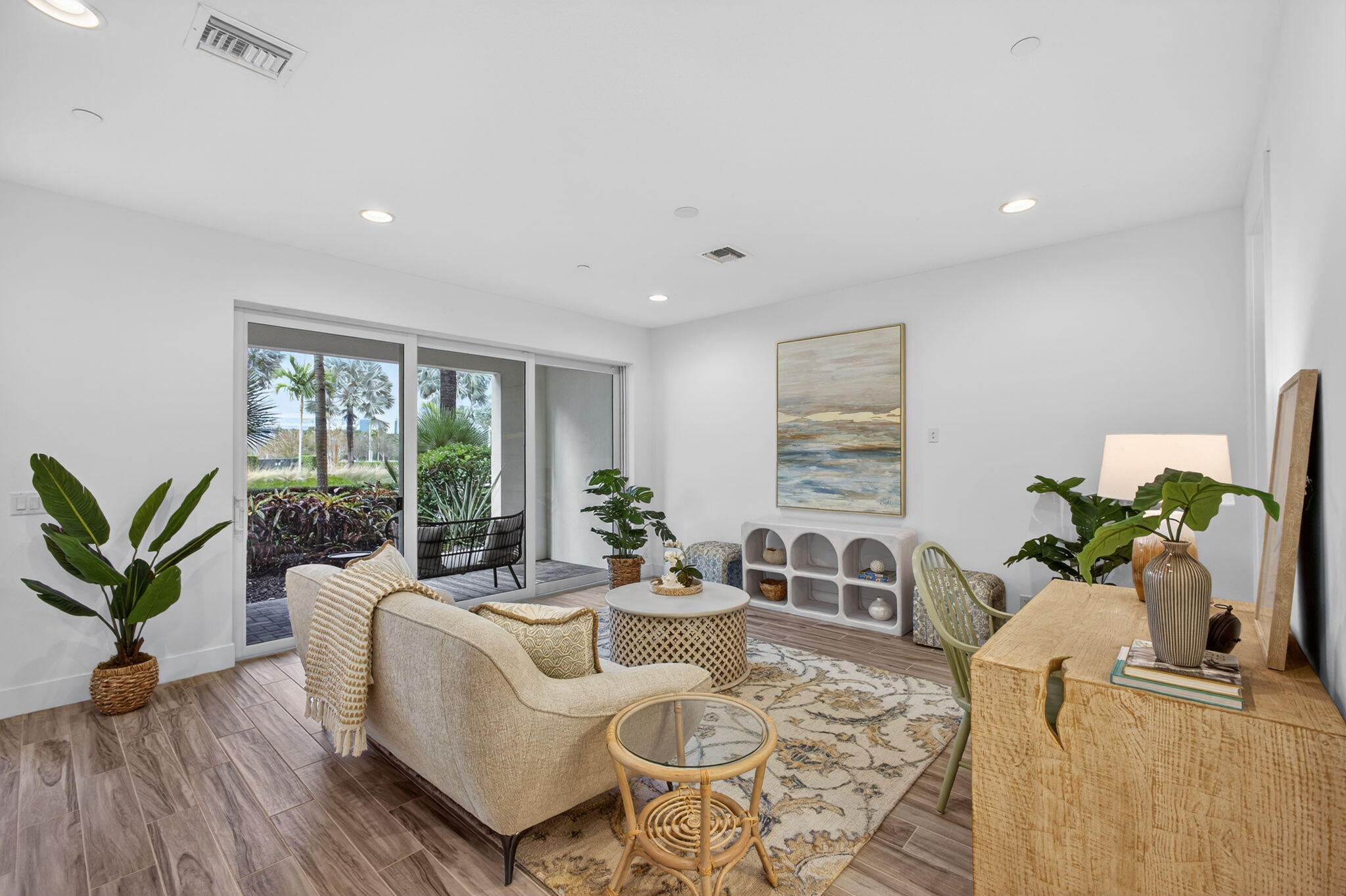 13392 Alton Road Palm Beach Gardens, FL 33418 - Photo 7 of 57 a living room with furniture potted plant and a large window