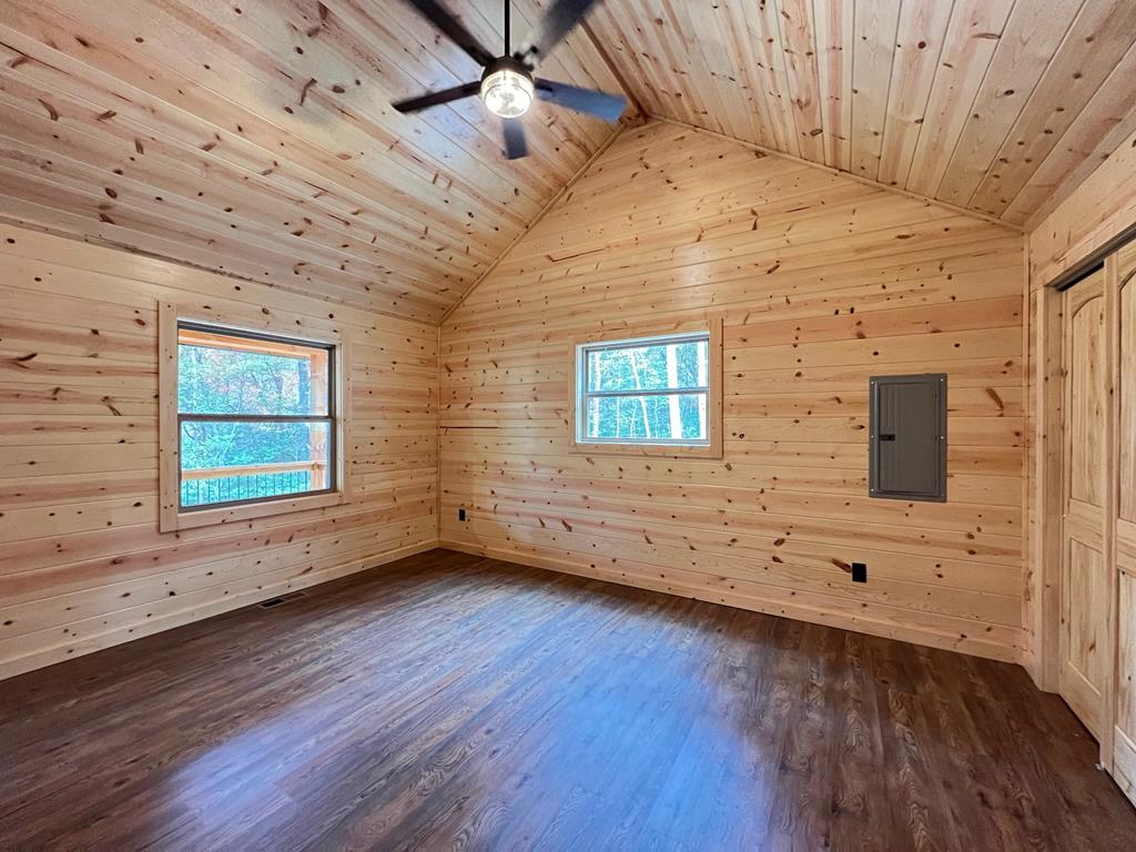 94 Ranger Trail Way Murphy, NC 28906 - Photo 11 of 25 a view of an empty room with wooden floor and a window