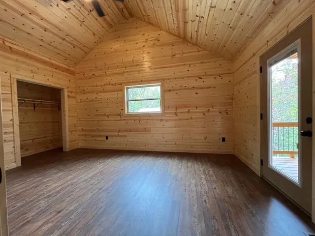 a view of a room with wooden floors and natural light