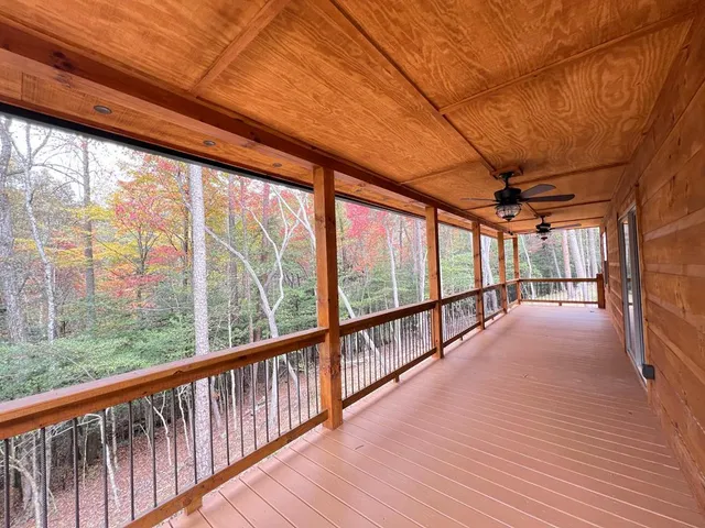 a view of porch with wooden floor