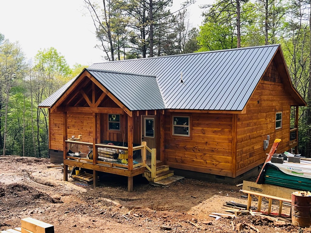 94 Ranger Trail Way Murphy, NC 28906 - Photo 2 of 25 a front view of a house with a garden