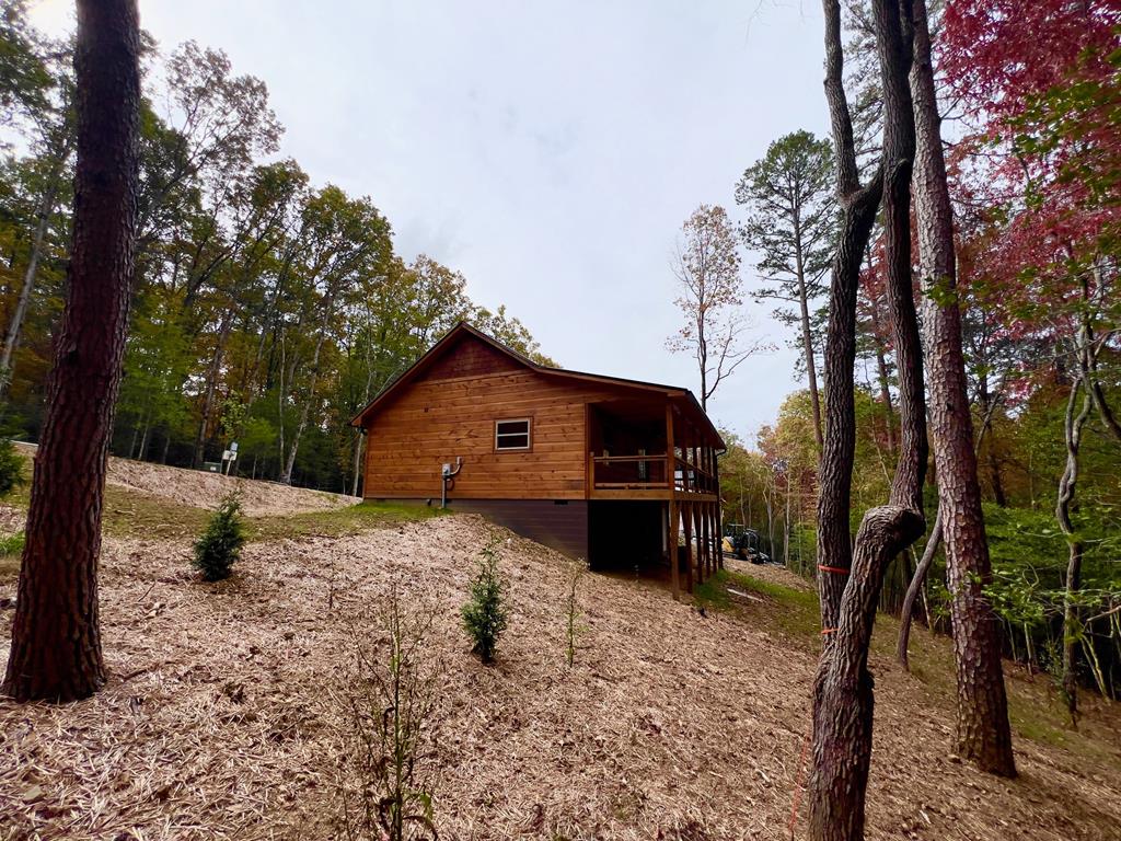 94 Ranger Trail Way Murphy, NC 28906 - Photo 23 of 25 a front view of a house with a yard covered in snow