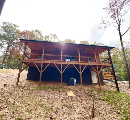 an area with wooden fence and roof