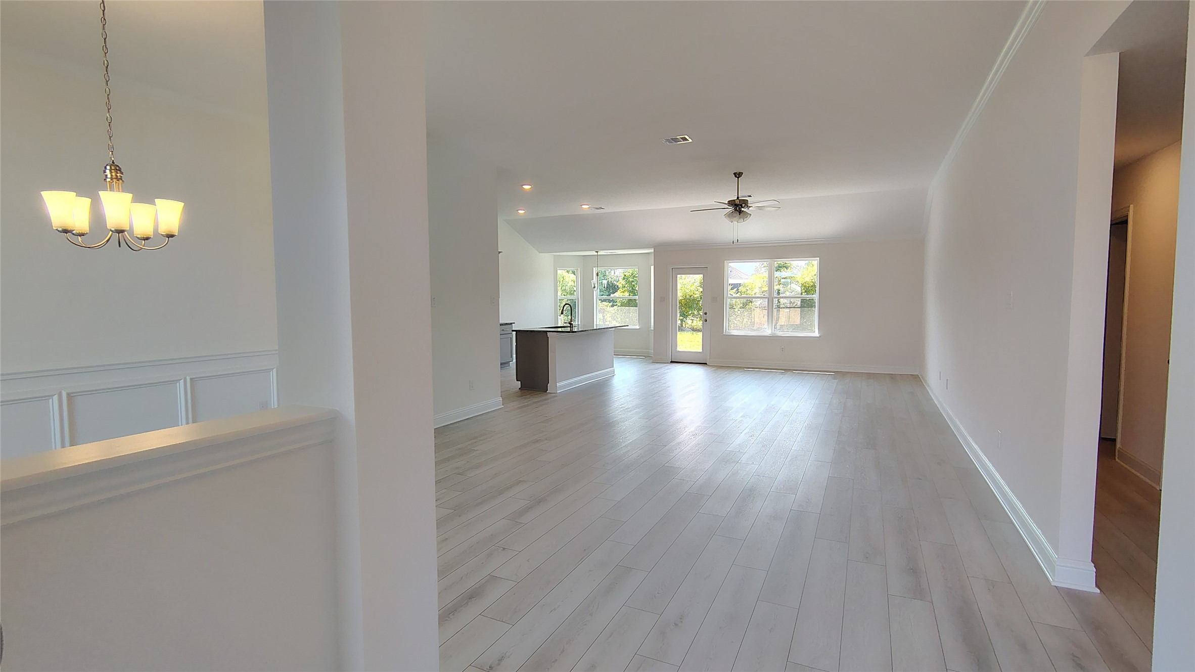 640 Greystone Lane Angleton, TX 77515 - Photo 3 of 17 wooden floor in an empty room with a window