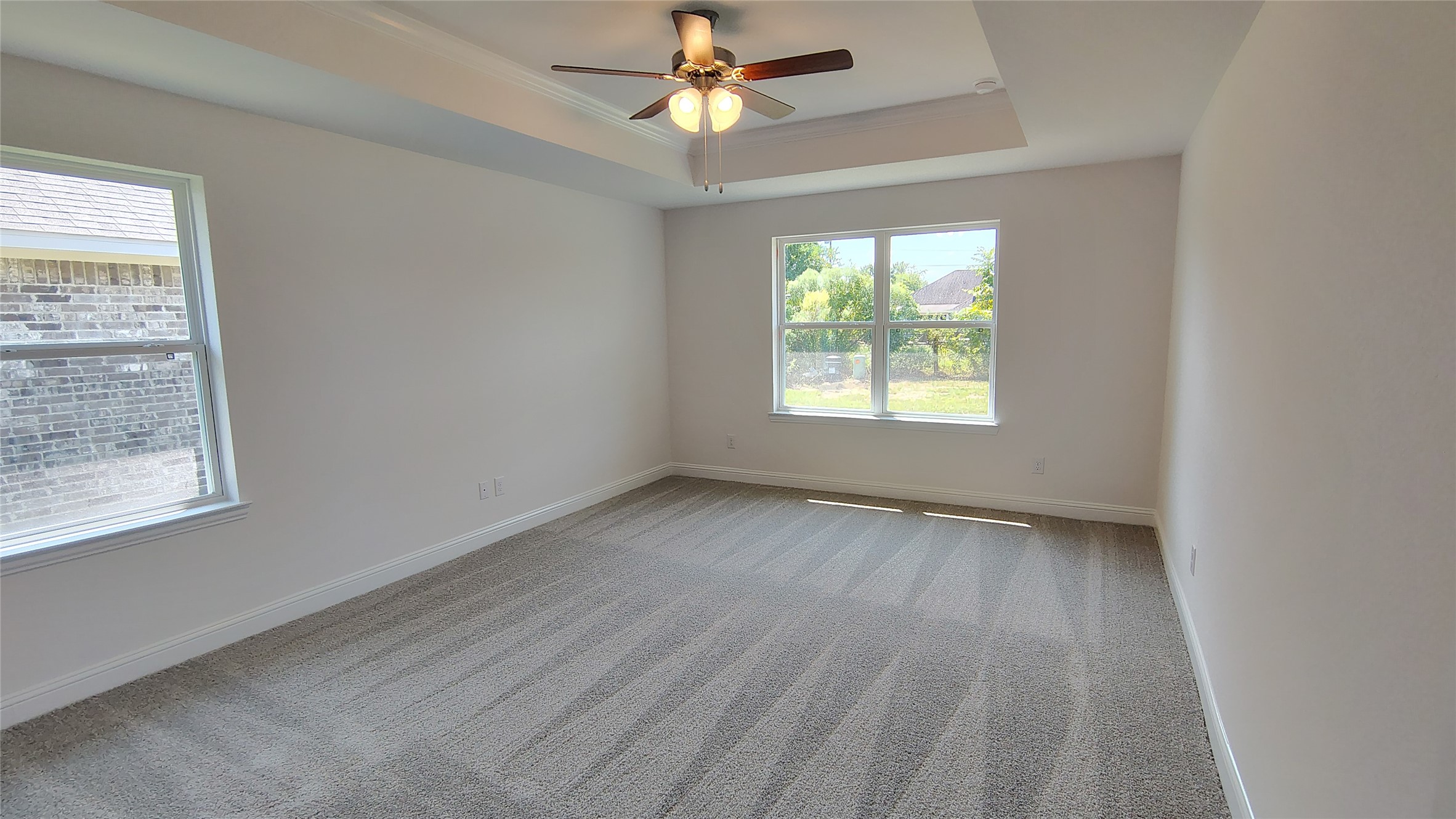 640 Greystone Lane Angleton, TX 77515 - Photo 9 of 17 an empty room with windows and fan