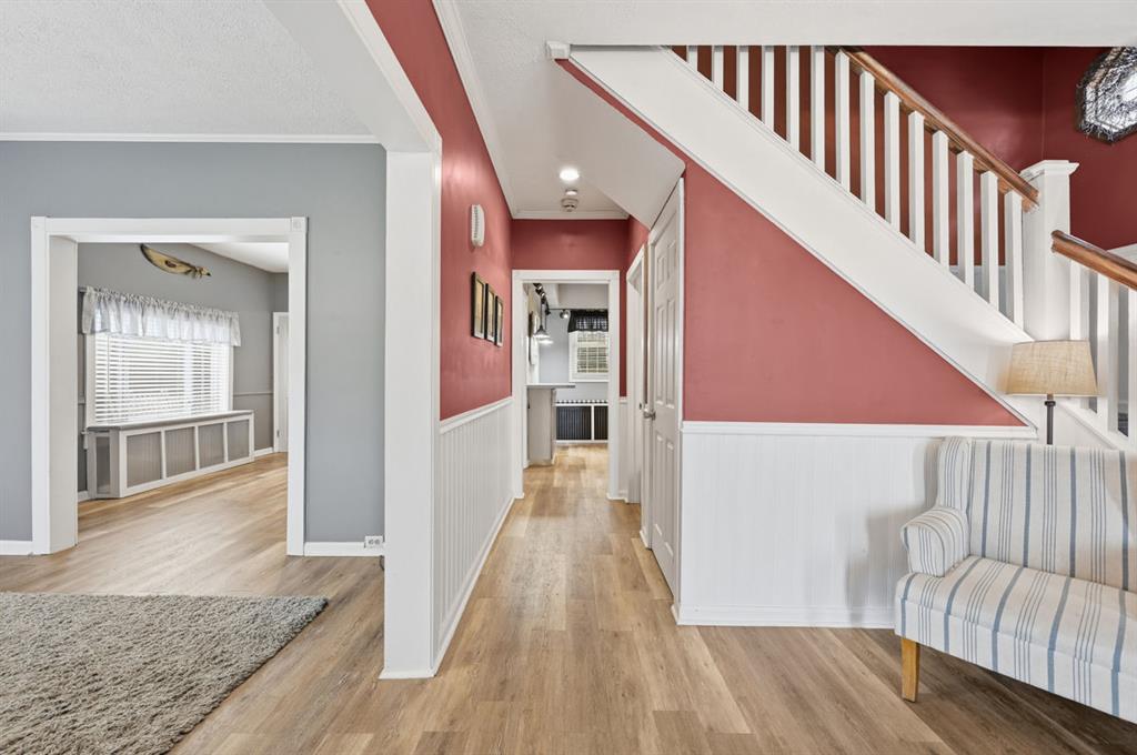 144 Davis Avenue McKees Rocks, PA 15136 - Photo 12 of 50 a view of a hallway with wooden floor and staircase