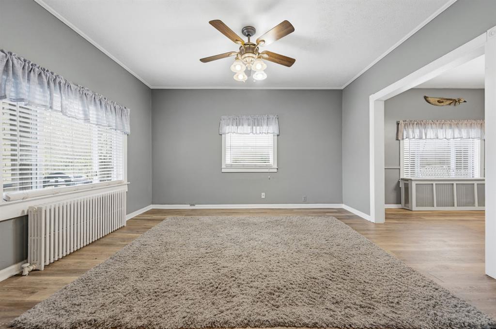 144 Davis Avenue McKees Rocks, PA 15136 - Photo 14 of 50 an empty room with chandelier fan and windows